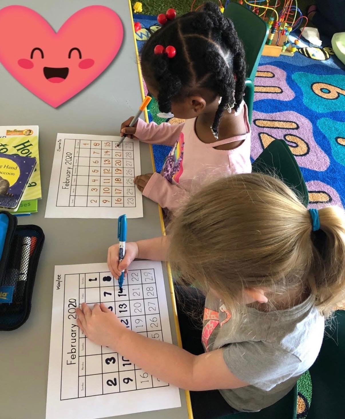 Preschoolers marking a February calendar during circle time
